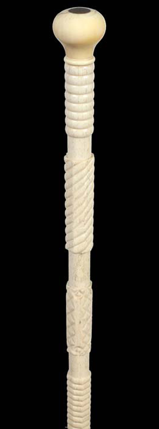 Nautical whalebone cane, circa 1870, carved whale’s tooth for a handle with an inlaid tortoise disc atop, ribbed and other architectural carvings on the shaft. Estimate: $1,400-$1,600. Kimball M. Sterling Inc. image.