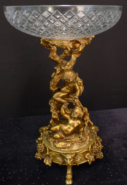 Dore bronze centerpiece with cupids climbing a tree base and glass stands, made circa 1880. Stevens Auction Co. image.
