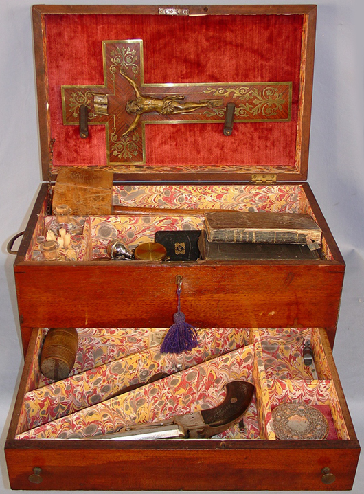 Nineteenth century vampire killing kit, with cross, rosary, Bible, gun powder and wood stakes. Stevens Auction Co. image.