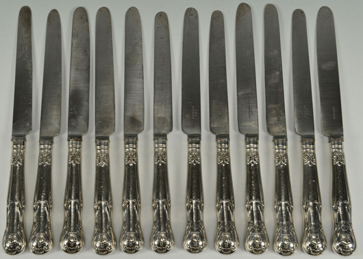 A set of 12 sterling handled dinner knives, made by female silversmith Mary Chawner for Queen Adelaide of England, circa 1837, and bearing her royal crest, served up $2,106 against a $500-$800 estimate. Case Antiques image.