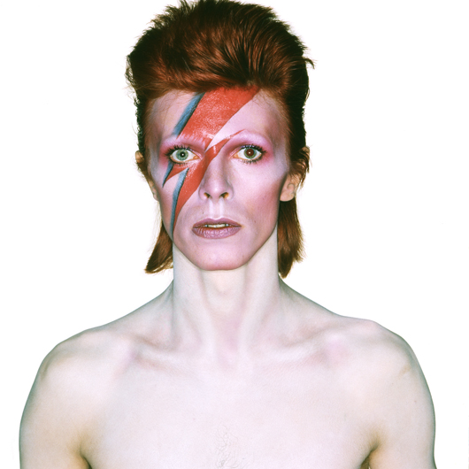 Album cover shoot of David Bowie for 'Aladdin Sane.' Design by Brian Duffy and Celia Philo, make up by Pierre La Roche, 1973. Credit line: © Duffy Archive. Special terms: David Bowie is. Courtesy of Victoria and Albert Museum.
