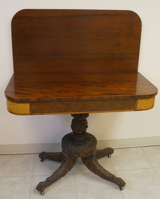 Greek Revival gaming table, plum pudding mahogany, satinwood veneer, tiger-maple corners, est. $1,000-$1,500. Tonya A. Cameron Auctions image.