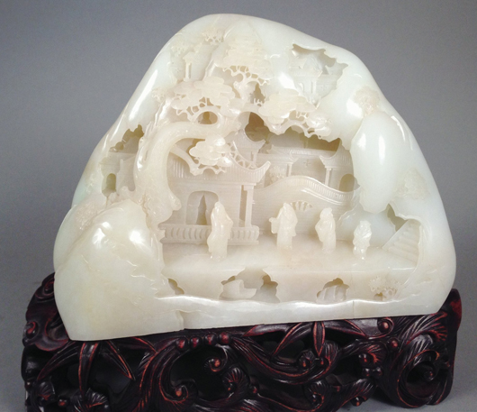 Circa-1890s carved white jade mountain on rosewood pedestal base, est. $50,000-$80,000. Tonya A. Cameron Auctions image.