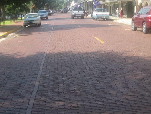 Historic brick street in downtown Natchitoches, La. Image by Billy Hathorn. This file is licensed under the Creative Commons Attribution-Share Alike 3.0 Unported license.