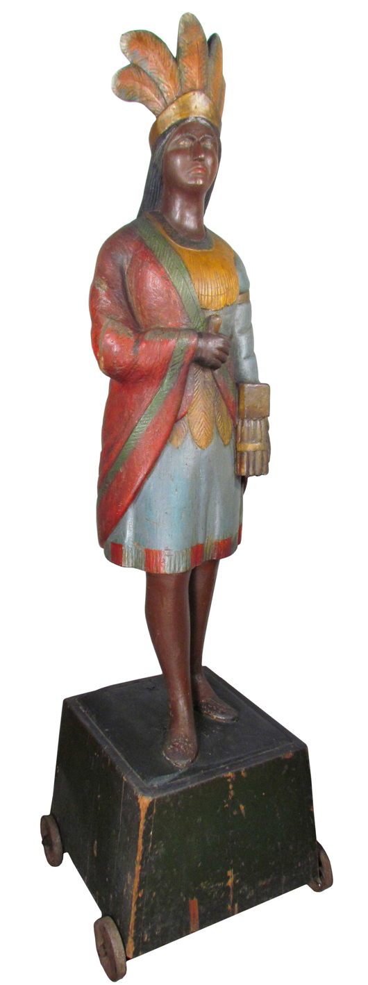 Circa 1880s wooden cigar store Indian, 83 inches tall, possibly carved by Thomas Brooks (est. $50,000-$75,000). Showtime Auctions image.