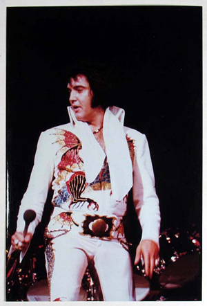 Elvis Presley at a live performance. Image courtesy of LiveAuctioneers.com Archive and Pioneer Auction Gallery.