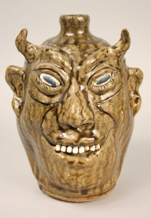 The devil face jug became best-selling variation on the form. This example, covered in an olive green alkaline glaze and signed by Georgia potter Lanier Meaders (1917-1998), sold for $2,000 at Case Auction in 2009. Courtesy Case Auctions.