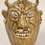 The devil face jug became best-selling variation on the form. This example, covered in an olive green alkaline glaze and signed by Georgia potter Lanier Meaders (1917-1998), sold for $2,000 at Case Auction in 2009. Courtesy Case Auctions.
