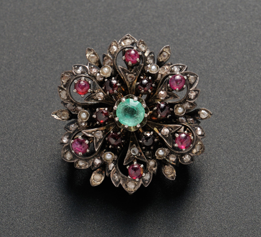 Blackened 14K gold, diamond, emerald, ruby, and seed pearl pin. Estimate: $200-300. Skinner Inc. image.