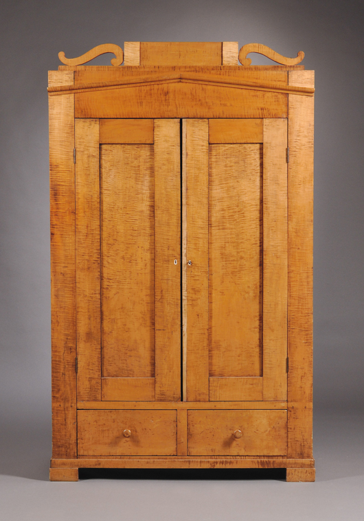 Classical tiger maple wardrobe cabinet with two paneled doors. Estimate: $800-1,200. Skinner Inc. image.