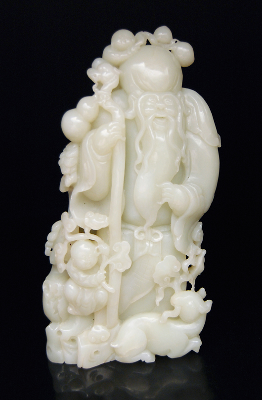 Shoulao, the god of Longevity, is shown on rockwork with children and a goat. The grouping is carved of pale-greenish white jade. Height 9 3/4 inches Estimate: $20,000-$30,000. Image courtesy of Gianguan Auctions.
