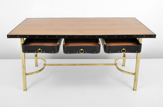 Circa-1950 Jacques Adnet (French, 1984-1984) desk with leather-wrapped drawers, metal studs, ring pulls. Est. $25,000-$45,000. Palm Beach Modern Auctions image.