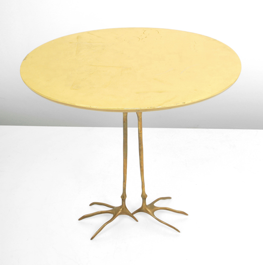 Meret Oppenheim (German/Swiss, 1913-1985) for Simon Gavina (Italy) “Traccia” table, gold leaf over wood top, “bird” legs. Est. $4,500-$6,500. Palm Beach Modern Auctions image.