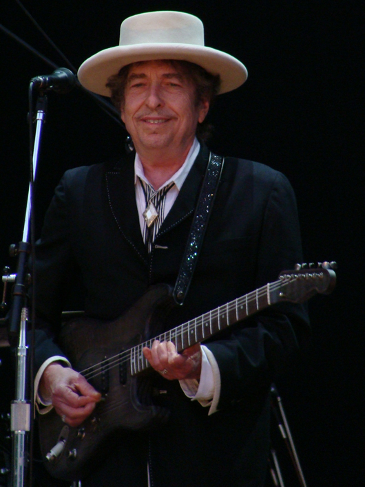 Bob Dylan at a concert in 2010. Image by Alberto Cabello from Vitoria Gasteiz. This file is licensed under the Creative Commons Attribution 2.0 Generic license.