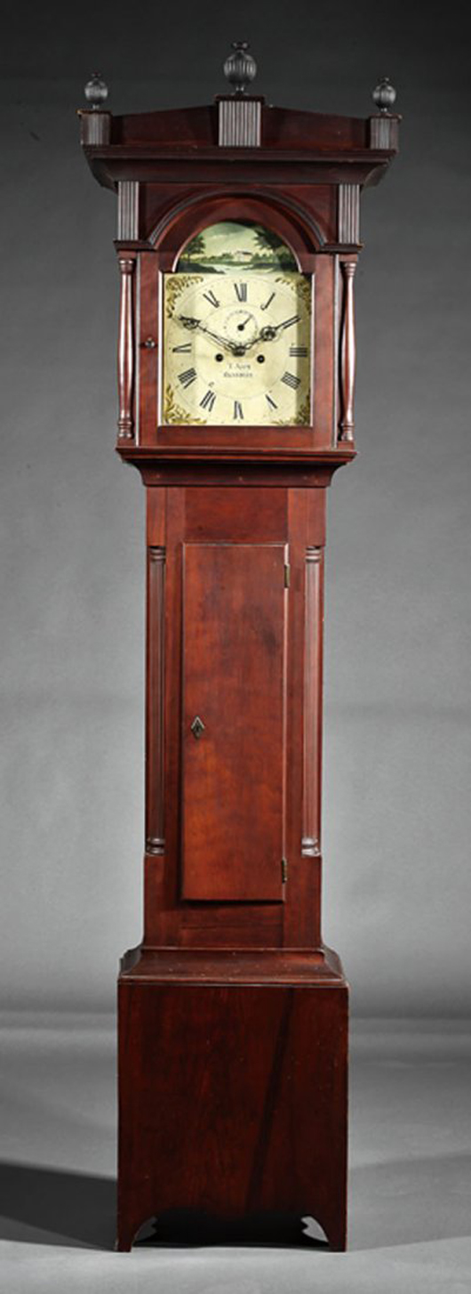 Thomas R.J. Ayers of Danville, Ky., crafted this American carved cherrywood tall-case clock circa 1845. It sold for $30,000. Neal Auction Co. image.