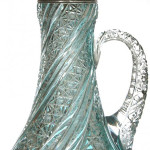 This 16-inch turquoise cut to clear claret jug attributed to J. Hoare, with embossed Gorham sterling spout sold for $75,000. Woody Auction image.