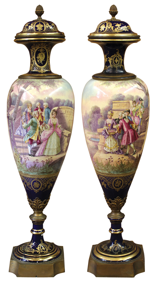 This pair of monumental scenic vases, possibly Sevres, was estimated at $4,000 to $6,000 but sold for $11,035. Clars Auction Gallery image.
