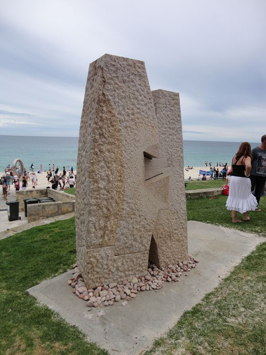 Seattle-based sculptor Richard Rhodes’ ‘Embrace,’ from his Sentinel series, drawing enthusiastic admirers at the Cottesloe edition of Sculpture by the Sea. Photo courtesy Sculpture by the Sea.