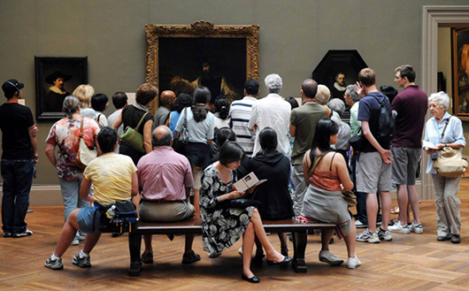Visitors to The Metropolitan Museum of Art enjoying a display of Old Master paintings. Image courtesy of The Metropolitan Museum of Art.