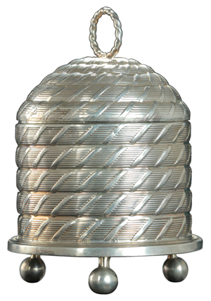 A 5-inch-high English silver honey pot shaped like a bee skep was estimated at $4,500 to $5,000 at a recent Garth's auction in Ohio. It has 1810 London hallmarks. The same skep sold at a 2005 Maine auction for $2,875.
