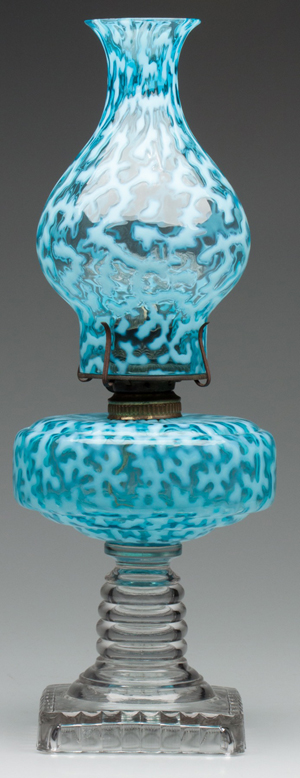 This Coral Reef / Seaweed squat stand lamp featuring a blue opalescent font, with a no 2 fluted collar, fitted with a period no. 2 burner and rare chimney-shade, by Hobbs, Brockunier & Co. or Beaumont Glass Co., sold for a record $5,175. Jeffrey S. Evans & Associates image.
