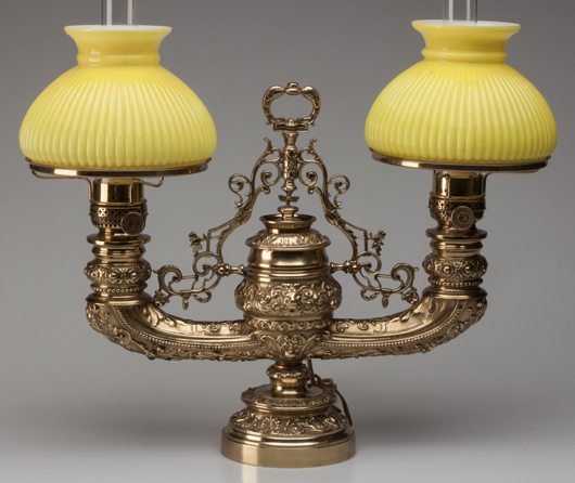 Cast brass Plume & Atwood ‘Harvard’ double-arm student lamp, with horizontal tanks. Price realized: $2,760. Jeffrey S. Evans & Associates image.