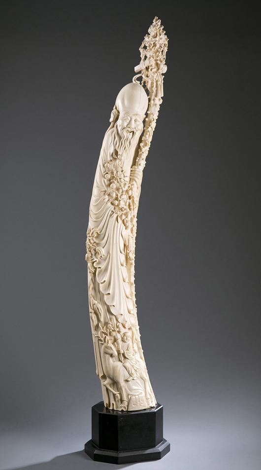 Monumental Chinese carved ivory tusk in the form of deity Shou-Lao, late 19th/early 20th century. 45½in tall on 5¾in base. Estimate $25,000-$35,000. Quinn’s image.
