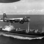 A U.S. Navy P-2H Neptune of VP-18 flying over a Soviet cargo ship with crated II-28s on deck during the Cuban Crisis. Image courtesy of Wikimedia Commons.