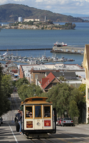 A San Francisco cable car no. 3 heading south on Hyde Street with Alcatraz Island in the distant background. Image by John O'Neill. Permission is granted to copy, distribute and/or modify this document under the terms of the GNU Free Documentation License, Version 1.2 only as published by the Free Software Foundation.