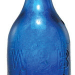 An unusual metal closure was used on this cobalt blue Superior Mineral Water bottle made by Union Glass Works of Philadelphia. It sold for $15,680 at American Bottle Auctions of Sacramento, Calif.