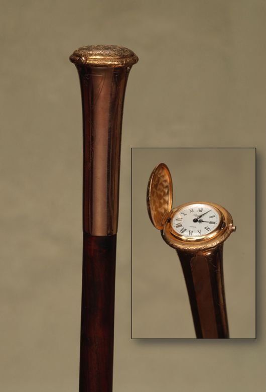 Elegant gold watch cane. Tradewinds Antiques image.