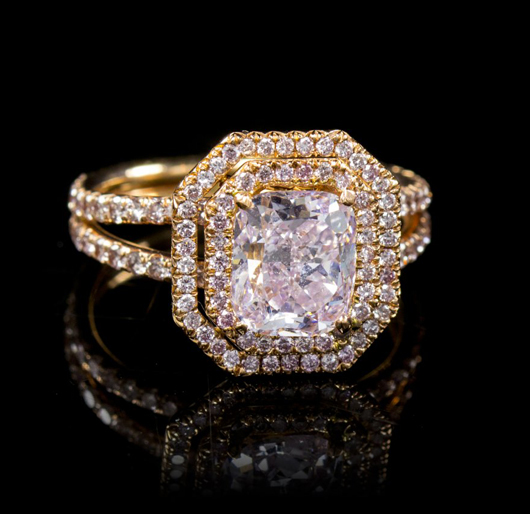 This 18K rose gold and fancy purple pink diamond ring sold for $302,500. Leslie Hindman Auctioneers image.