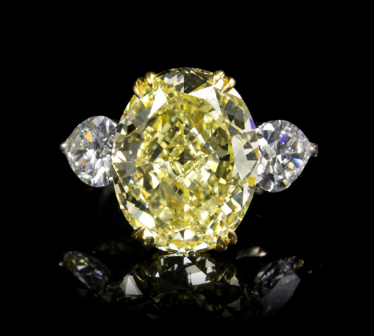 Fancy yellow oval brilliant cut diamond ring, 10.99 carats. Price realized $170,500. Leslie Hindman Auctioneers image.