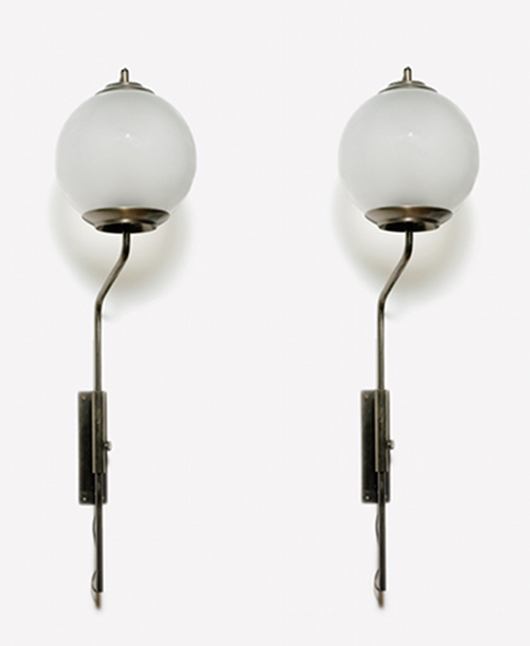 Pair of adjustable wall lamps LP11. Brass structure, satined glass globes. By Luigi Caccia Dominioni. Azucena, 1953. Est. € 2,500-3,000. E-Art Auctions image.
