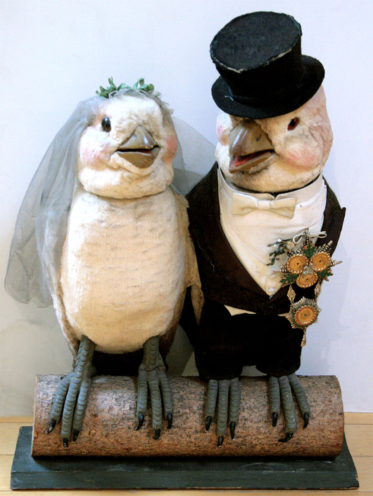 Animated, electric-powered store window display of birds in bridal attire. Ross Art Group image.