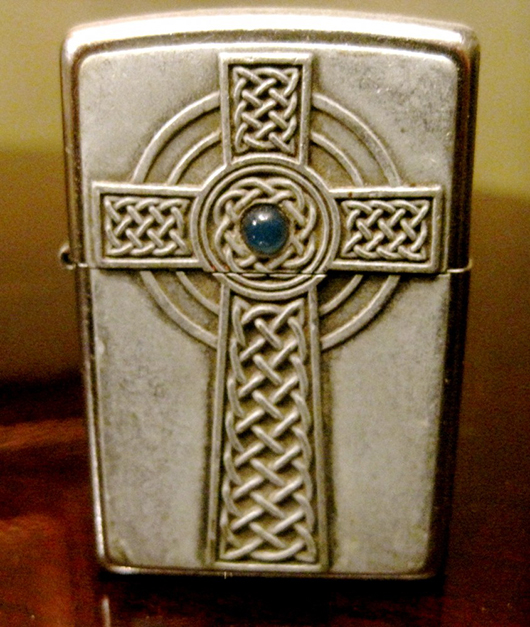 This Celtic cross lighter with blue pearl-like inlay reminds Vincent of filming in Ireland in 2003.