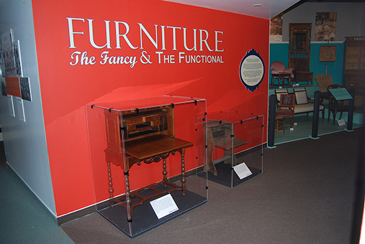 The exhibit’s entry features two desks, one fancy and one functional. The writing desk on the left was used by First Lady Grace Coolidge and given to Sen. Peter Norbeck’s wife, Lydia. The desk on the right was a Christmas gift from a father to his daughter in 1911. As a child, the daughter dreamed of becoming a teacher. She fulfilled that dream and the desk traveled with her as she taught in a variety of schools. Courtesy of the Museum of the South Dakota State Historical Society.