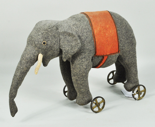 Felt stuffed elephant pull toy. Woodbury Auction image.