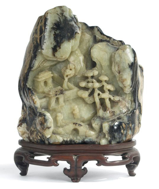 Chinese carved pale celadon, brown and russet jade mountain, 17th/18th century. Gray’s Auctioneers.