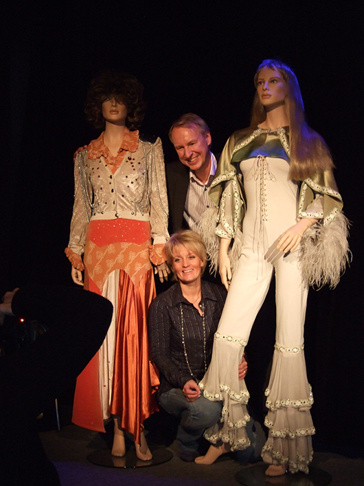 Ewa Wigenheim-Westman and Ulf Westman, founders of ABBA the Museum, with costumes worn by the 1970s group. Image by Song bird 3. This file is licensed under the Creative Commons Attribution-Share Alike 3.0 Unported license.  