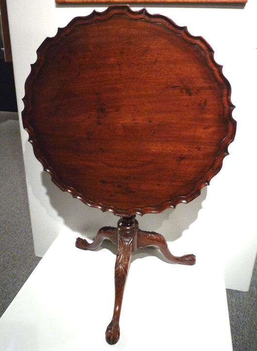 Perhaps my favorite in this gallery from the early section is the birdcage piecrust tilt-top table, also from Philadelphia, circa 1750-1780. This table has the popular but very expensive to make scalloped pie crust top, found in only one in 10 tables of the period, the Pennsylvania-style floating collar under the bird cage above the typical Pennsylvania compressed ball and column, acanthus carved knees and elongated ball and claw feet with a flattened ball.
