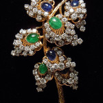Dazzling 14K yellow gold diamond, emerald and sapphire cocktail ring with a total gross weight of 32 carats. Estimate: $2,000-$3,000. Matheson’s Auctions image.
