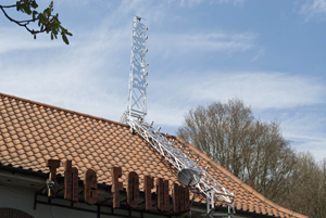Award-winning British artist Jonathan Wright's latest art installation: a functional radio transmission tower atop the roof of The Forum, a live-music venue in Tunbridge Wells, England. Image provided by Jonathan Wright.