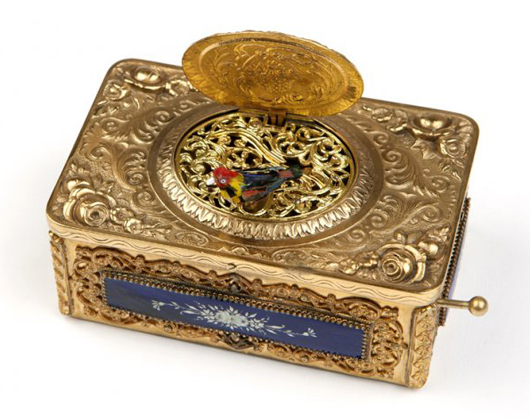 This silver-gilt singing bird box, of German manufacture, the works possibly by Griesbaum or Eschle, is decorated with cobalt enameled plaques (estimate: $2,500-$3,500). John Moran Auctioneers image.