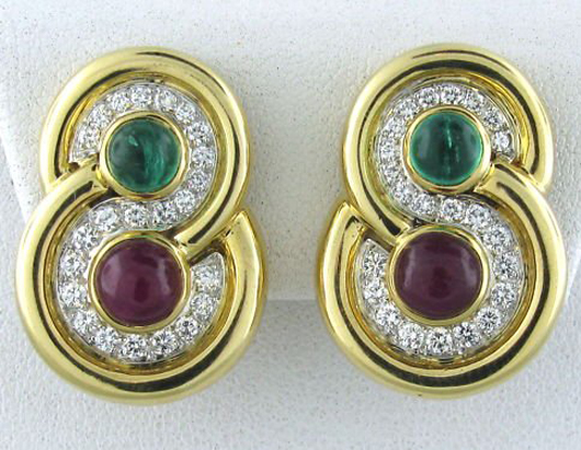 David Webb 18K gold and platinum, emerald, ruby and diamond earrings. Hampton Estate Auction image. 