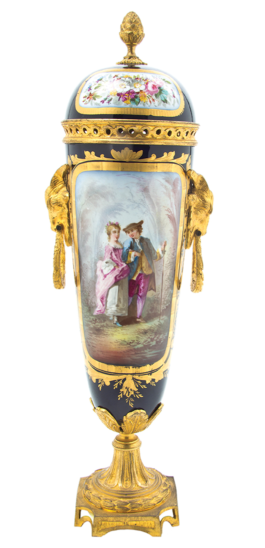 A courting couple is pictured on this Sevres-style porcelain urn. It has gilt metal mounts and a lid. The 17-1/2-inch urn sold for $1,750 at a 2013 Leslie Hindman auction in Chicago.