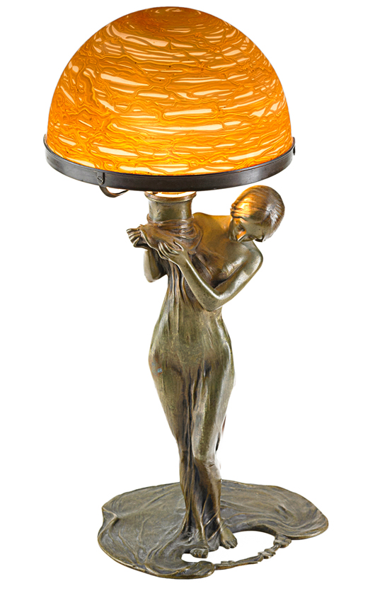 This lamp, created from a figure of a bronze woman and an iridescent gold glass shade made by Loetz, is 14 inches high. The signed lamp sold this spring for $3,750 at Rago Arts and Auction Center in Lambertville, N.J. 