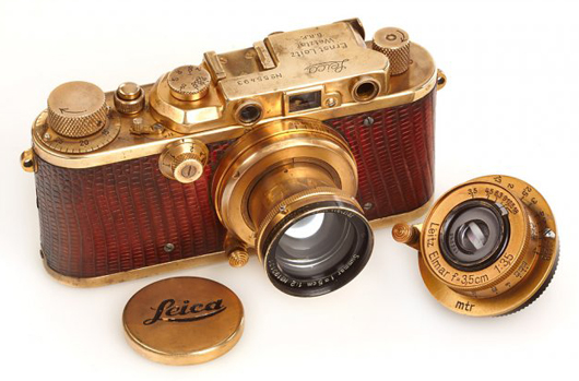 1931 Leica III 'Luxus' camera, gold plated and trimmed in brown lizard leather, with two lenses. Price realized: $683,000. Image courtesy of Westlicht Photographica Auction.