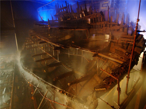The Mary Rose undergoing conservation at the historic dockyard in Portsmouth, England. Image courtesy of the Mary Rose Trust. This file is licensed under the Creative Commons Attribution-Share Alike 2.0 Unported license. 