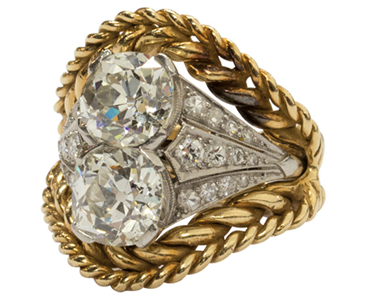 This Art Deco platinum and diamond ring, highlighting by two old European cut diamonds and accompanied by a 14K yellow gold twisted wire ring jacket, surpassed its high estimate selling for $22,610. Clars Auction Gallery image.
